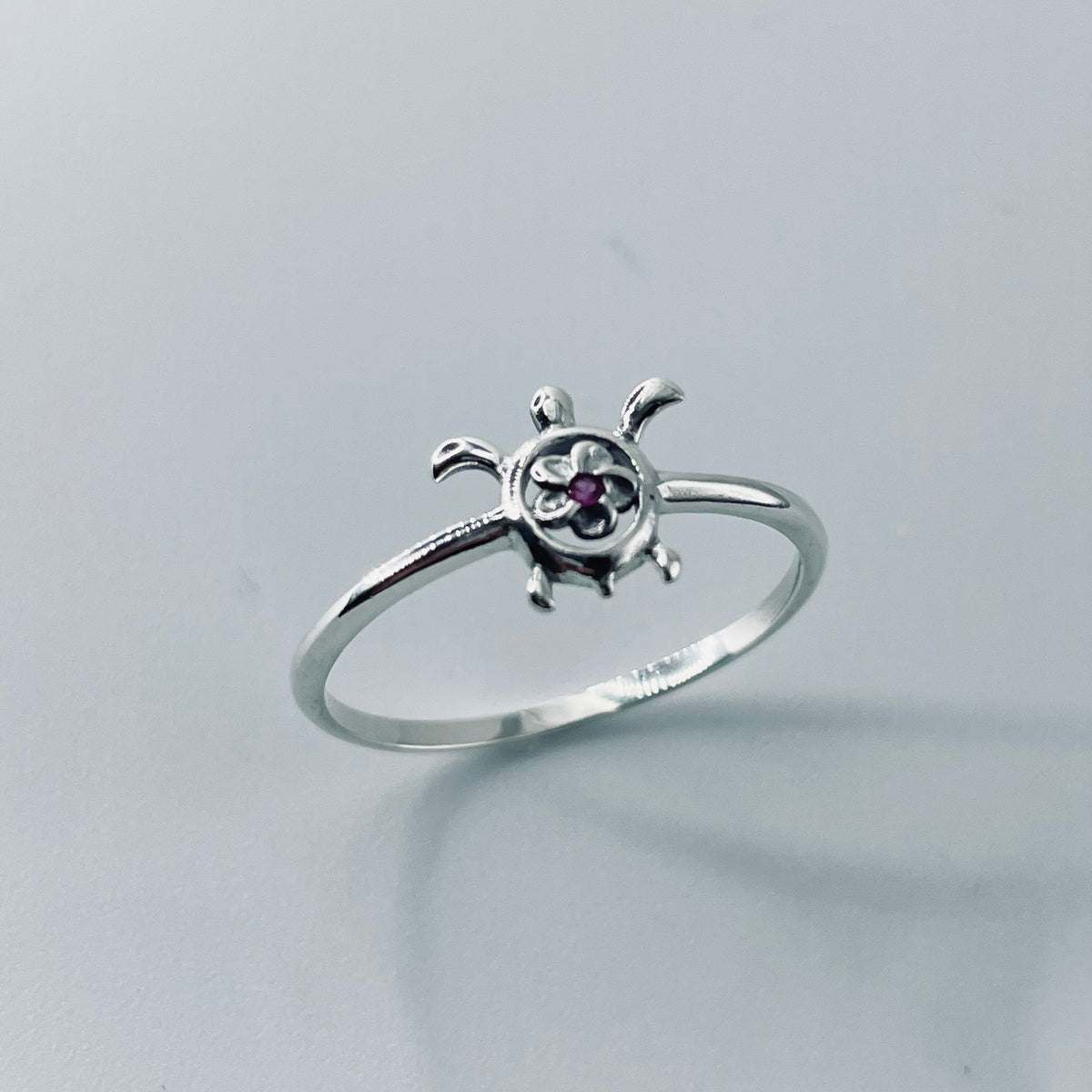 Sterling Silver Plumeria Flower Turtle Ring with Ruby CZ